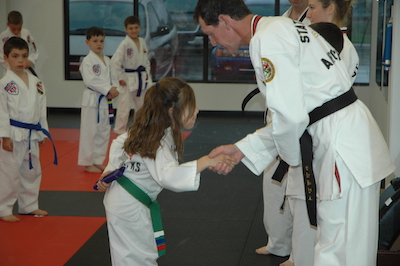 student profile page showing belt promotions of student